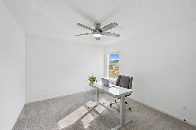 Third upstairs bedroom with closet, fan and lots of sunlight! | Image 26