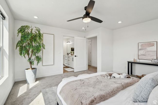 Bedroom featuring recessed lighting, a ceiling fan, light carpet, ensuite bath, and baseboards | Image 17