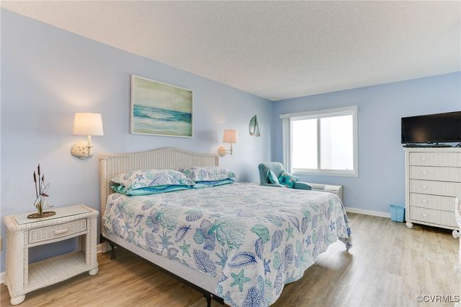 Bedroom featuring LVP floors, baseboards | Image 11