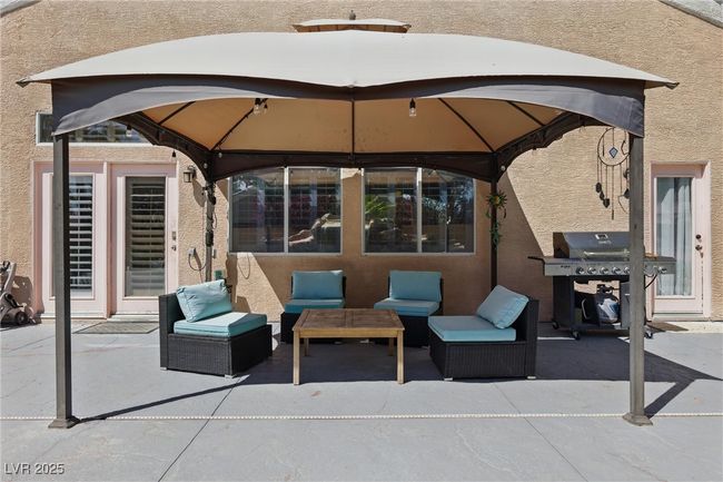View of patio / terrace with a gazebo, an outdoor hangout area, and area for grilling | Image 39