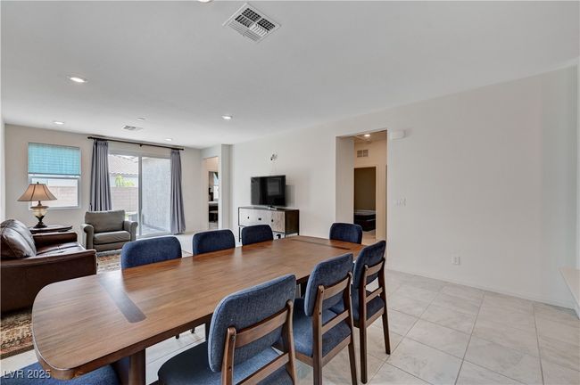 Dining area with light tile patterned floors, recessed lighting, and baseboards | Image 9