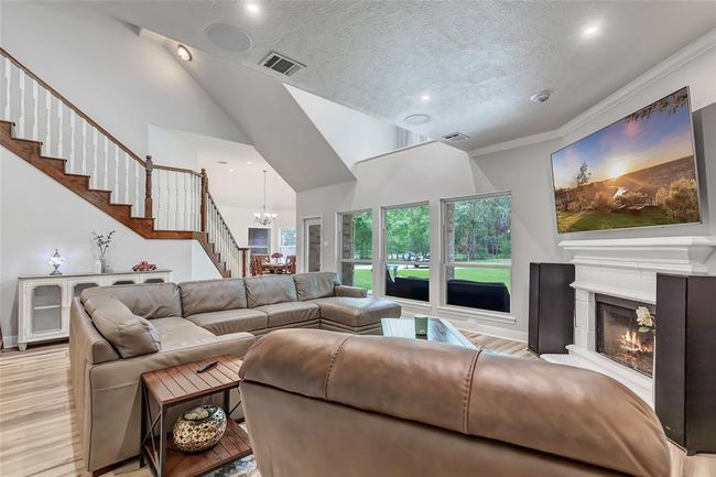 Living Room open to the breakfast area and upstairs with high ceilings and surround sound | Image 13