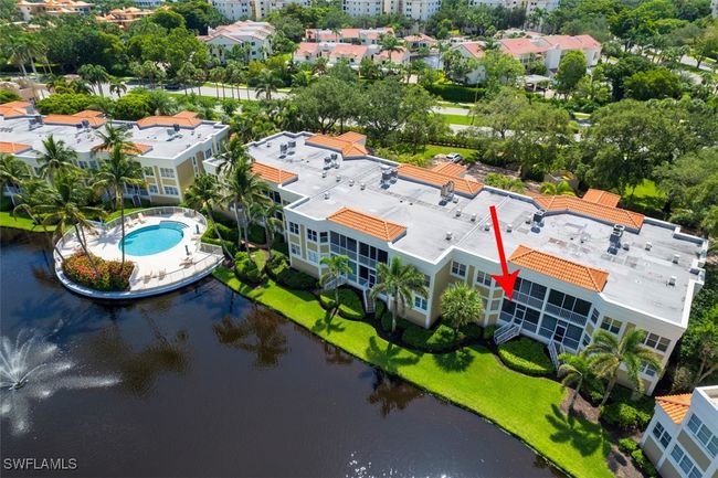 Drone / aerial view of a nearby body of water and a pool | Image 22