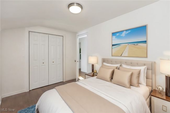 Bedroom with a closet and dark wood-type flooring | Image 33