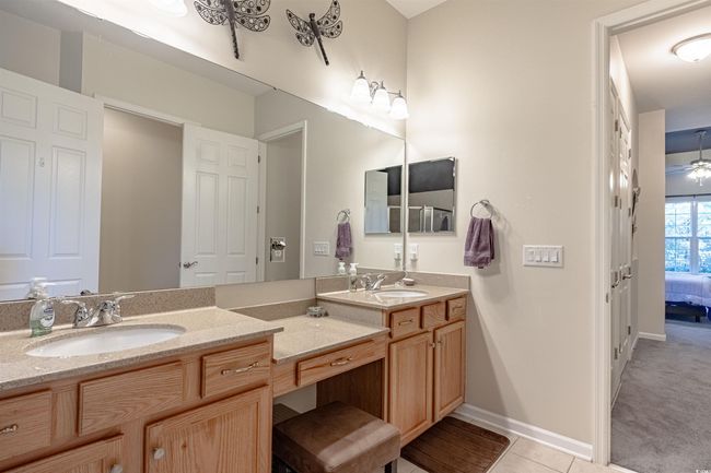Bathroom featuring tile patterned floors and vanity | Image 29