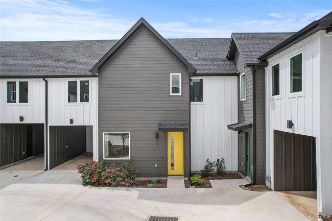 View of front of property featuring a shingled roof and board and batten siding | Image 6