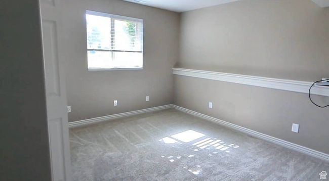 Carpeted empty room featuring baseboards | Image 45