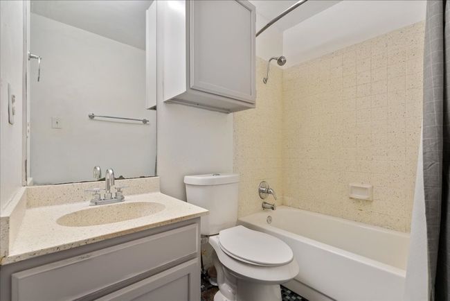 Full bath with tub / shower combination, toilet, and vanity | Image 8