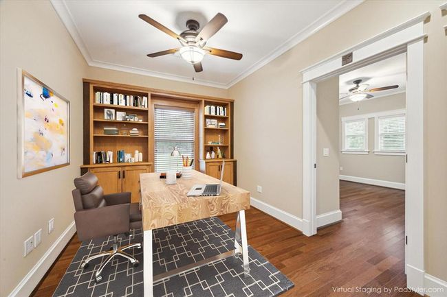 A WALL OF BEAUTIFULLY CRAFTED BURIL-IN BOOKSHELVES AND CABINETS CENTERED AROUND A CHARMING WINDOW BENCH. RICHLY FINISHED WITH CROWN MOLDING, AND WOOD FLOORING THROUGHOUT OFFICE AND SECONDARY BEDROOMS | Image 33