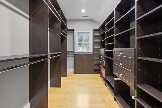 There is a very spacious walk-in closet. | Image 28