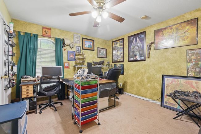 Carpeted home office with ceiling fan | Image 29