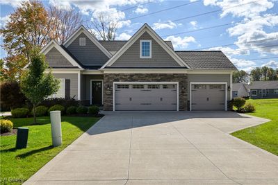 Craftsman house with a front yard and a garage | Image 2