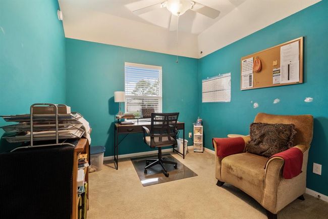 Secondary bedroom features awindow, custom paint, and plush carpet. | Image 19