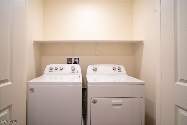 Washroom featuring washer and clothes dryer | Image 16