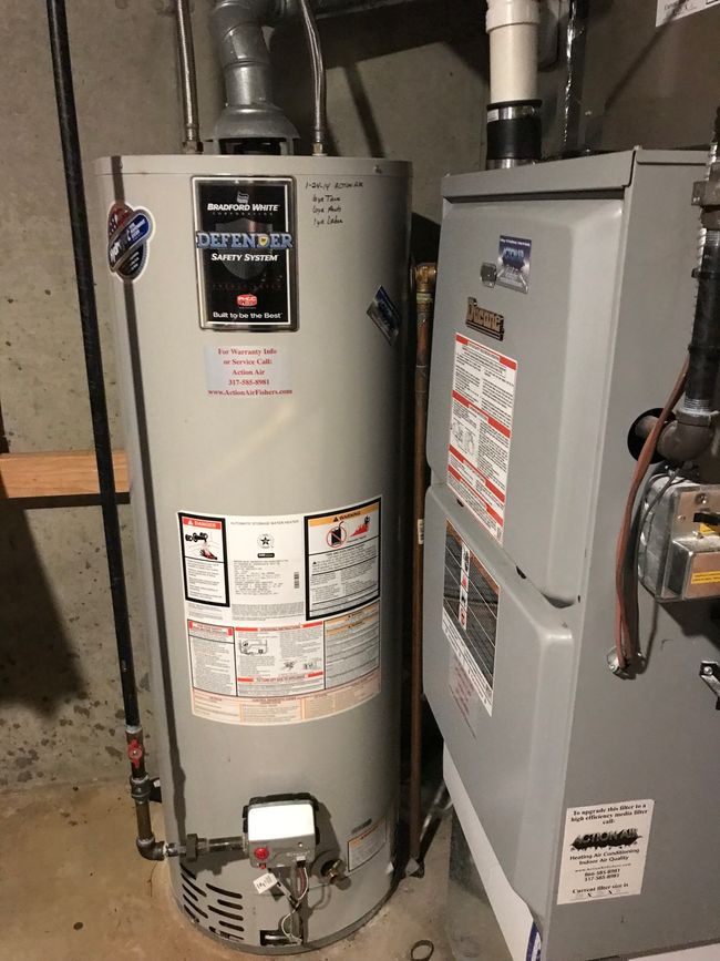 Water heater and furnace in basement work room | Image 41