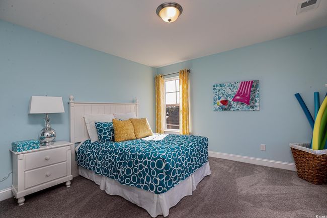 Bedroom featuring light carpet, visible vents, and baseboards | Image 22