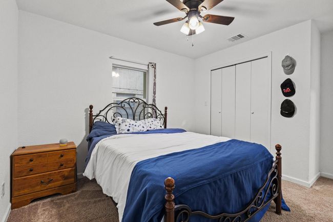 Bedroom featuring carpet floors, baseboards, a closet, and ceiling fan | Image 30