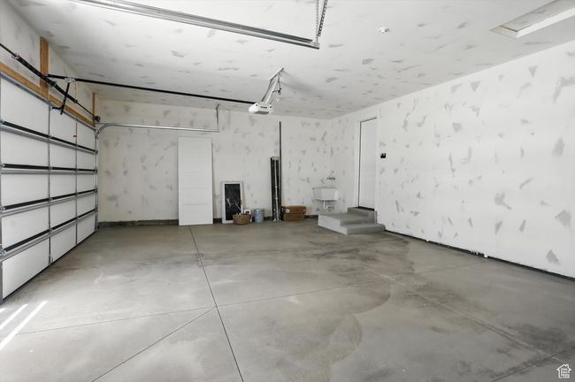 Garage featuring a garage door opener | Image 50