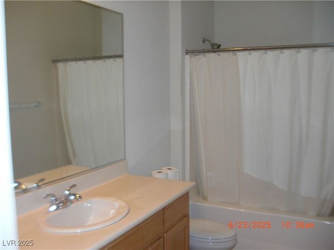 Bathroom with vanity and shower / bath combination with curtain | Image 12