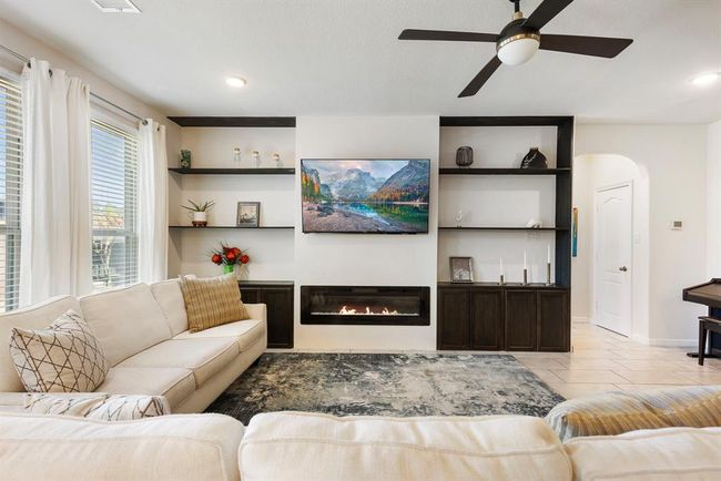 With an open layout and cozy atmosphere, this living area is the perfect space to spend time with friends and family. | Image 20
