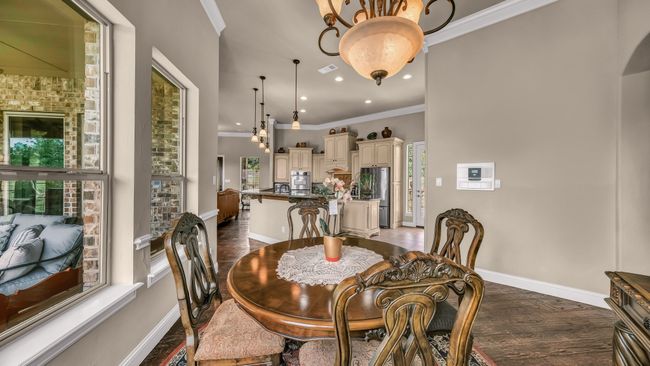Dining space with crown molding, recessed lighting, baseboards, and visible vents | Image 20
