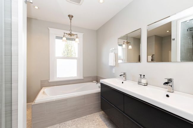 Bathroom featuring a sink, a garden tub, double vanity, and recessed lighting | Image 12