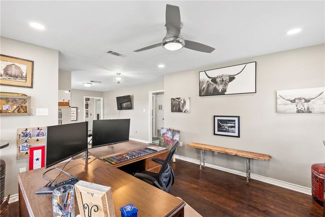Office space with ceiling fan, wood finished floors, and recessed lighting | Image 7
