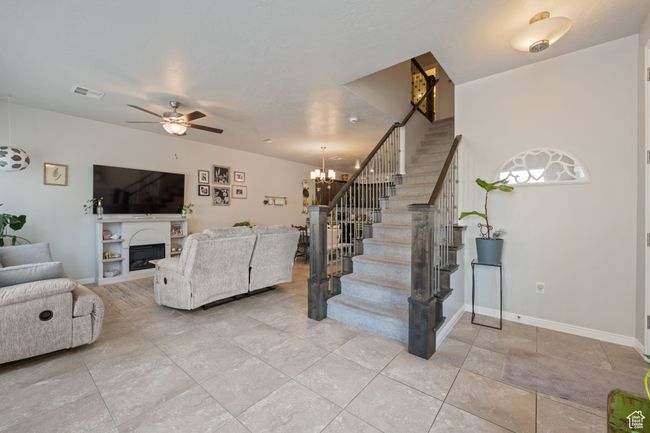 Living area with stairway | Image 7