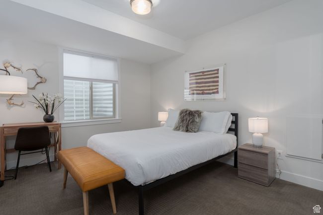 Carpeted bedroom with baseboards | Image 36