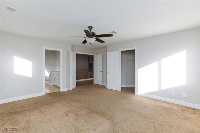Unfurnished bedroom featuring visible vents, baseboards, and carpet floors | Image 27