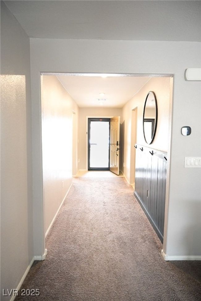 Corridor with baseboards and carpet | Image 7