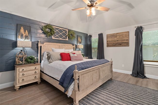 Primary bedroom featuring wood finished floors and a ceiling fan | Image 17
