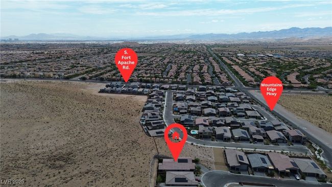 Aerial view of residential area featuring a mountainous background | Image 34