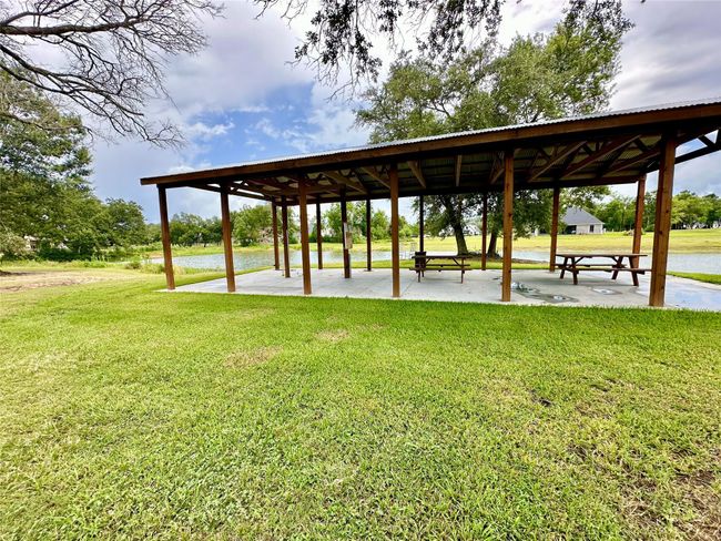 The pavilion offers several picnic tables and ample space for gatherings, all nestled in a peaceful setting surrounded by open green space, mature trees, and a relaxed natural atmosphere... BUT with this 10 acres property, this could be on YOUR OWN land! | Image 12