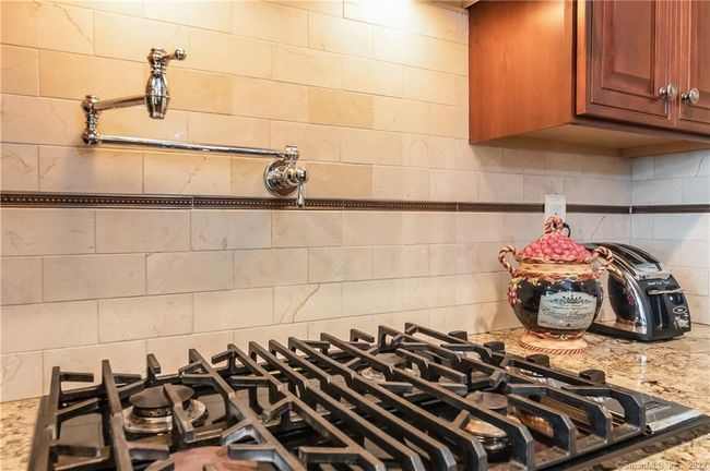 You didn't know you needed a pot filler, until you used one! This custom kitchen is sure to please... | Image 7