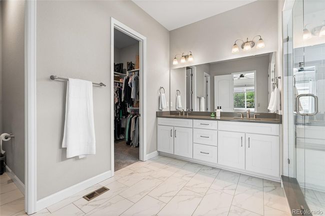 Primary spa-like ensuite with oversized shower (complete with rain shower head), linen closet and beautiful tile work. | Image 24