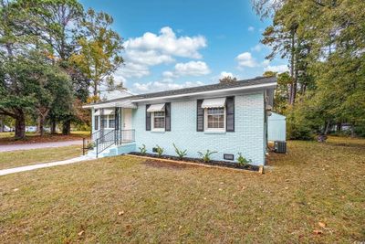 View of front facade featuring cooling unit and a front yard | Image 3