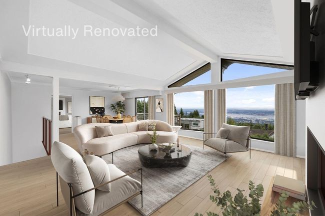 Living area with light wood finished floors and vaulted ceiling with beams | Image 8