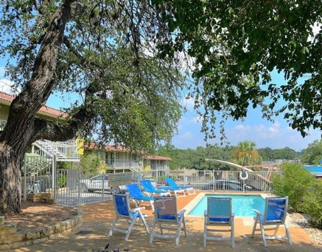 View of swimming pool featuring a patio area | Image 21