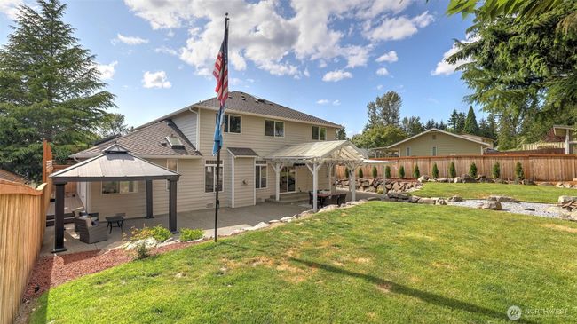 The backyard is fully fenced with a brand-new fence, providing added privacy and an excellent space for hosting private events! | Image 35