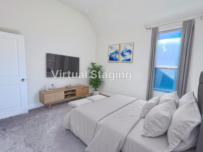 Carpeted bedroom with vaulted ceiling and baseboards | Image 34