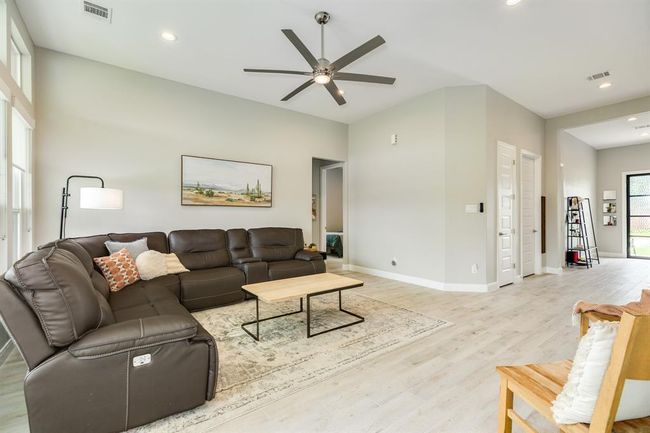 Another view of the bright andspacious living room. | Image 15