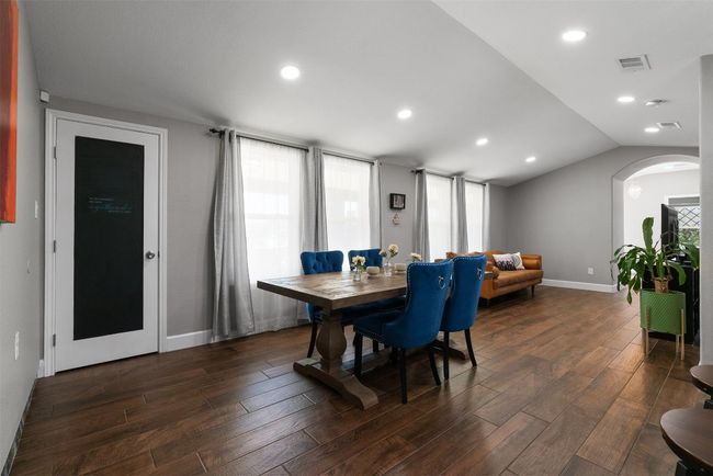 Surrounded by light from generous windows, the dining area invites both intimate meals and spontaneous gatherings, with a sense of openness that makes every meal feel like an event | Image 7