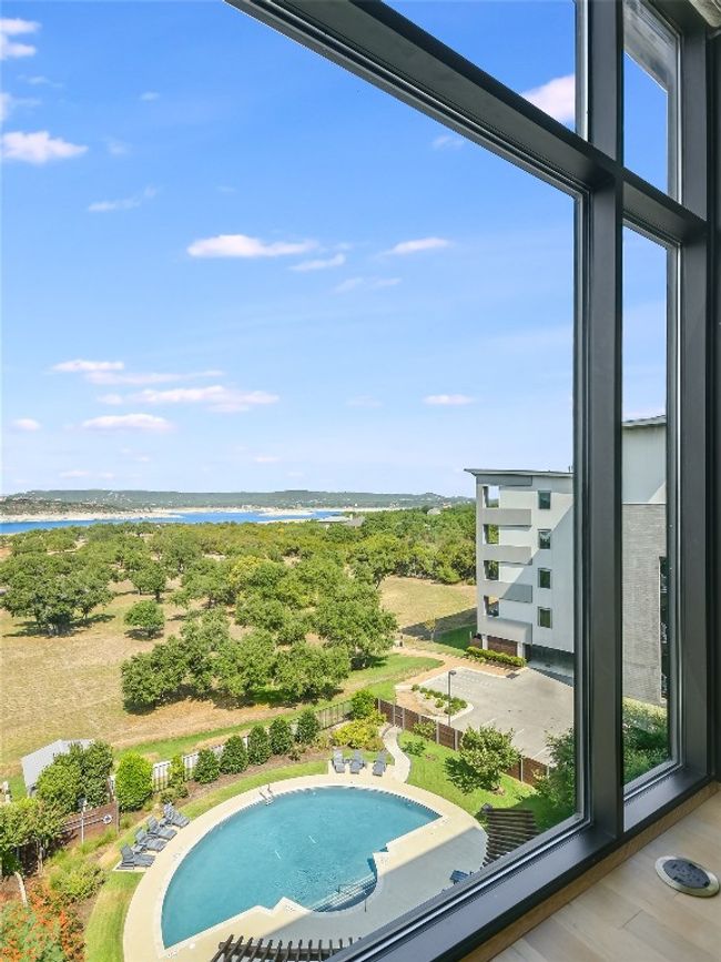 Striking views from the owner's bedroom. Note the electrical floor plug. Floor to ceiling windows come complete with automatic powered roller shades for added privacy. | Image 13