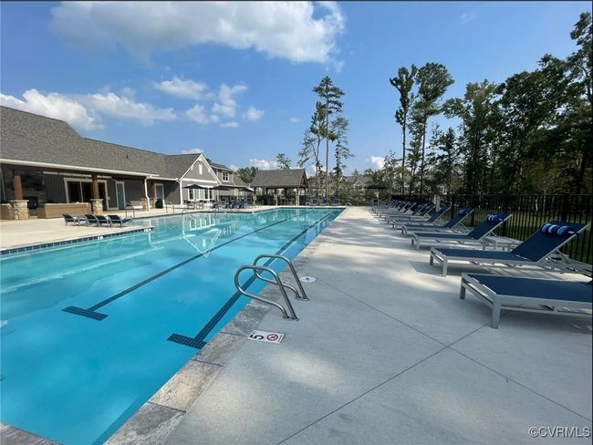 Community pool featuring a patio area | Image 44