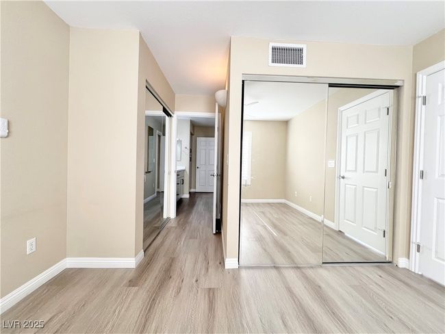 Primary bedroom with two closets with mirror doors | Image 4