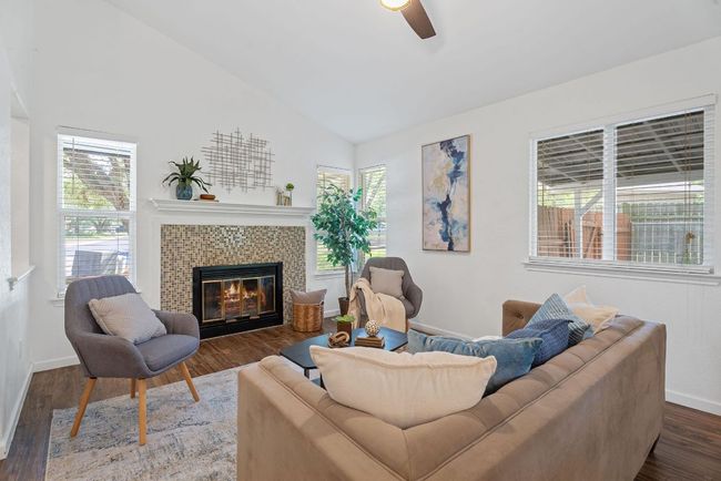 Lots of windows help this home feel both open and cozy | Image 4