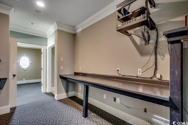 Laundry room with ornamental molding, carpet flooring, and baseboards | Image 14
