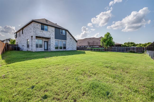 View of fenced backyard | Image 24
