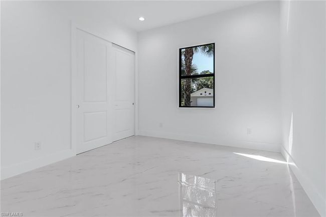 Unfurnished room featuring light tile patterned floors | Image 36
